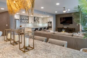 Modern luxury living room in Coral Gables designed by Rob Bowen Design featuring moody lighting and personalized scent diffusion.