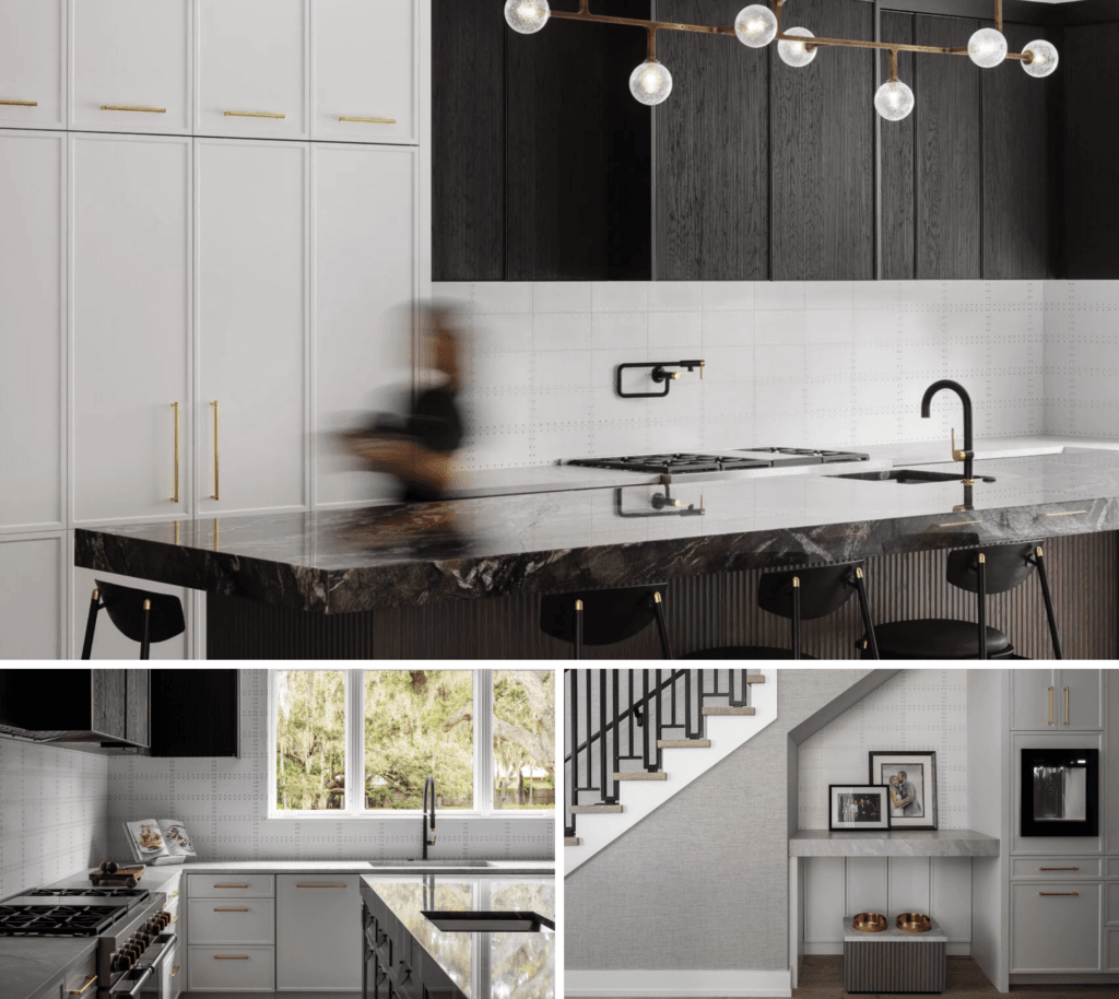 Modern kitchen with a marble countertop, built-in stovetop and sink, and a string of round pendant lights above. Built-in pet feeding station.